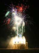 Fireworks pour from the art-deco pavilion beneath The Man.
