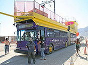 A huge bus coming through the Gate.