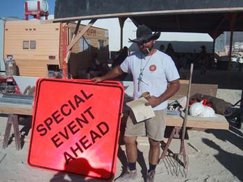 Sign shop manager, Honeymann, showing what's "special". (Photo by Flynn Mauthe)